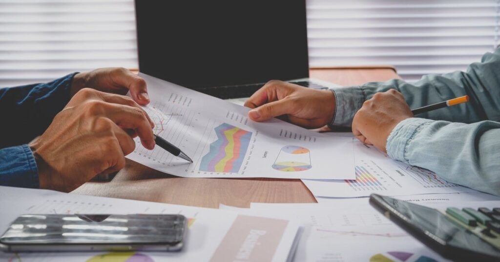 2 men reviewing charts together