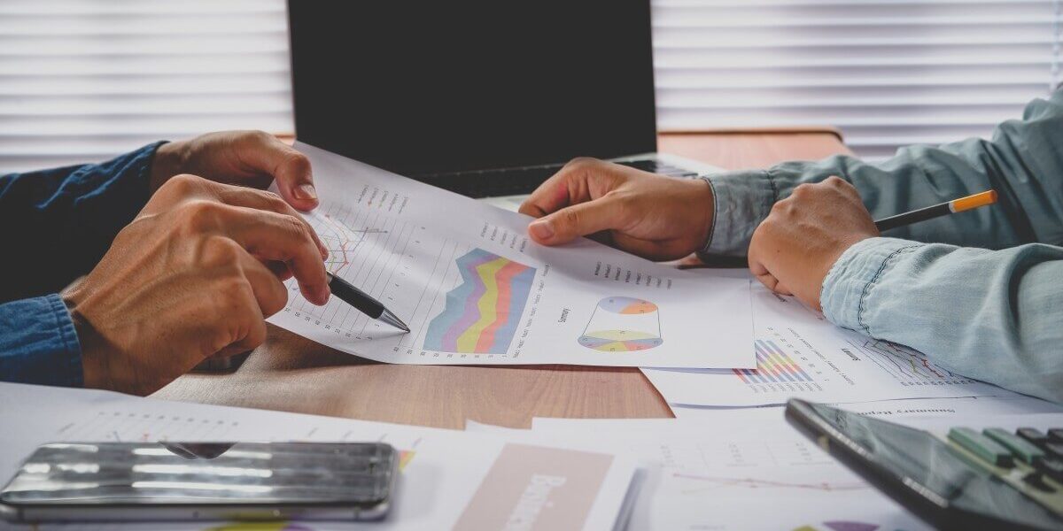 2 men reviewing charts together